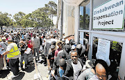 Zimbabweans stand in a long queue at a Home Affairs office in SA when a deportation deadline loomed. File photo.