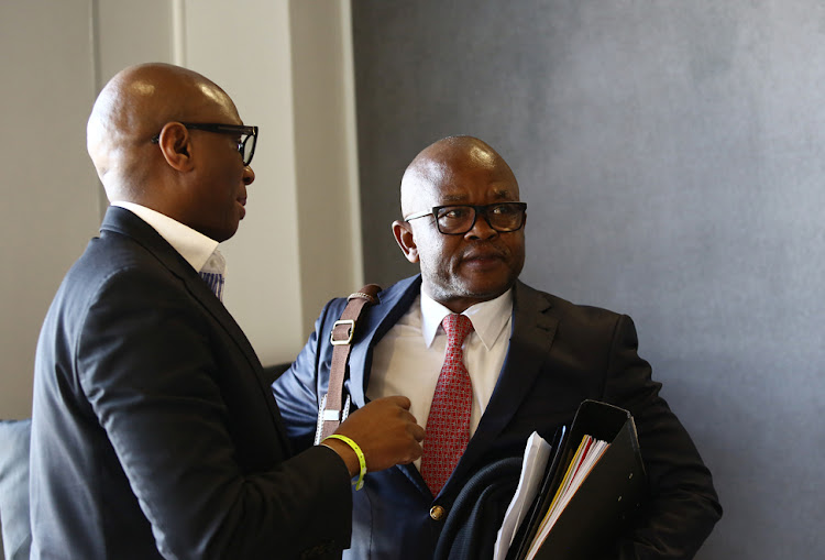 Former CEO of GCIS, Themba Maseko talks to Zizi Kodwa after giving his testimony at the state capture commission.