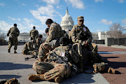 National Guard troops gather in front of the U.S. Capitol one day ahead of President-elect Joe Biden's Inauguration in Washington, U.S. January 19, 2021. 