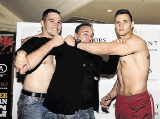 READY: Johnny Muller and Kevin Lerena flank Brian Mitchell during their pre-fight medical PHOTO: Nick Lourens