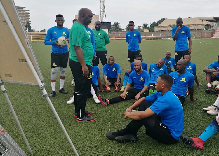 Mamelodi Sundowns' Caf Champions League-winning coach Pitso Mosimane chats to his players during a training session in Lome, Togo, on Monday July 15 2018 ahead of the clash against local giants AS Togo-Port.