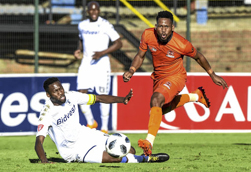 Wits captain Buhle Mkhwanazi tackles Edgar Manaka of Polokwane in yesterday's match.