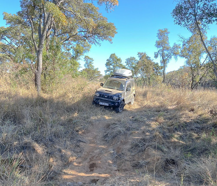 The author's Suzuki Jimny approaches a riverbed crossing on the Marakele national park eco 4x4 trail.