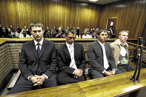 The Reitz 4, from left, Schalk van der Merwe, Johnny Roberts, RC Malherbe and Danie Grobler, pleaded guilty to forcing black cleaners to eat food apparently mixed with urine.