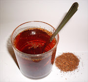 Rooibos tea in a glass with dry rooibos leaves. File photo