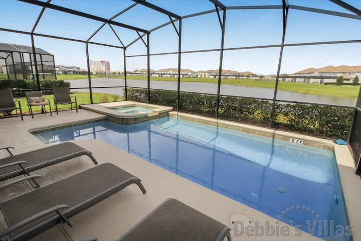 Storey Lake villa in Kissimmee with a lake view from the private pool and spa