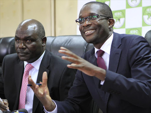 IEBC chairman Wafula Chebukati with CEO Ezra Chiloba during a past function. /MONICAH MWANGI