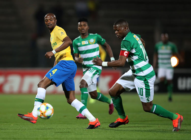 Tebogo Langerman of Mamelodi Sundowns (R) tries to stop Bloemfontein Celtic's captain and goalscorer Ndumiso Mabena.