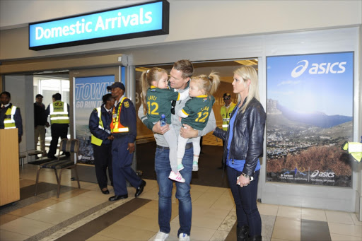 Springbok Captain, Jean de Villiers welcomed by his family during the Jean de Villiers homecoming at Cape Town International Airport on September 29, 2015 in Cape Town, South Africa.