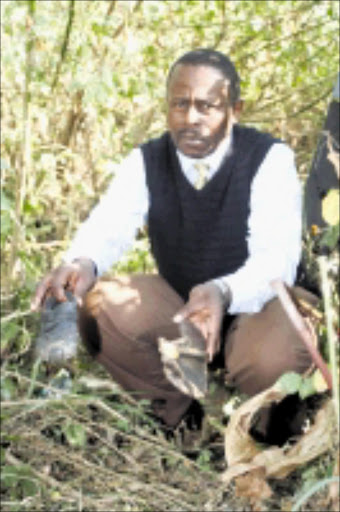 THE LAST WALK: Superintendent Buhle Ngidi at the crime scene where the two children were killed. Pic: Thuli Dlamini. © Sowetan.