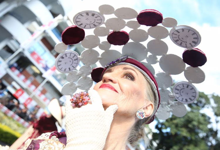 Never to old to rock that clock: Win Wheeler wearing a hat by her husband Mike at the Durban July.