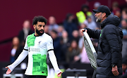 Mohamed Salah of Liverpool clashes with manager Jurgen Klopp during the Premier League match against West Ham United at London Stadium on Saturday.