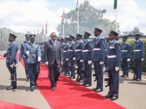 Namibian President Hago Geingob inspects a guard of honour after he arrived at State House on Ocober 19, 2018. / PSCU