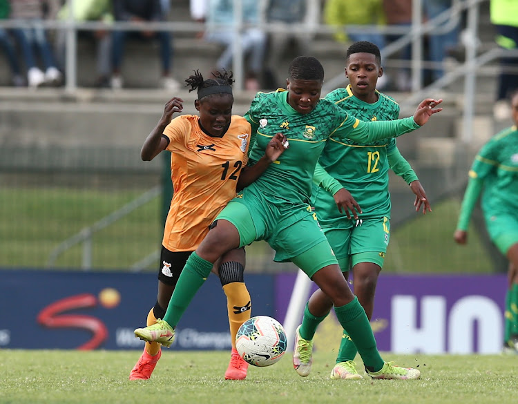 Evarine Suzeni Suzeni Suzeni Katongo of Zambia and Sphumelele Shamase of South Africa vie for the ball during the COSAFA Women's Championship final match between Zambia and South Africa.