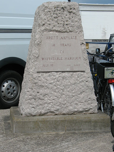 The inscription on the concrete pillar is already fading in the sea air, but reads: "Brett Asphalt - 50 years in Whitstable Harbour - July 97". There is also a logo of CVH France. See TR1067 :...