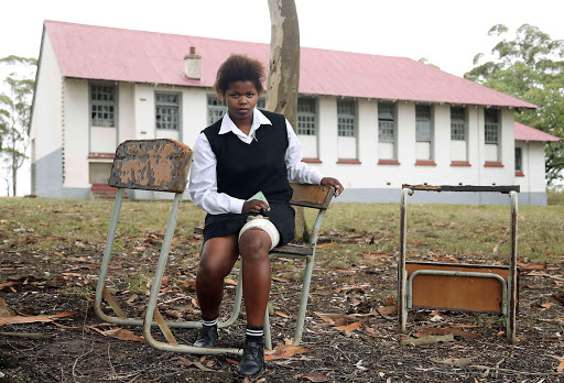 IN PAIN: Grade 8 pupil Nandipha Ngwendu, formerly from Knight Marabana Senior Secondary School in Peddie, sits at the spot where a bull gored her in the thigh a few weeks ago Picture: MARK ANDREWS