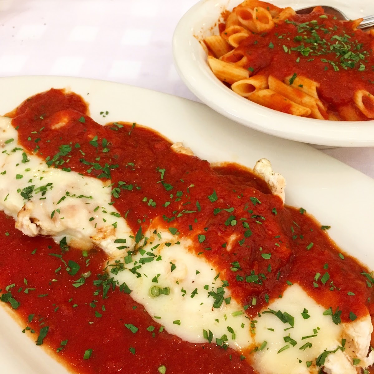 Chicken Parmesan and gf pasta with tomato sauce.