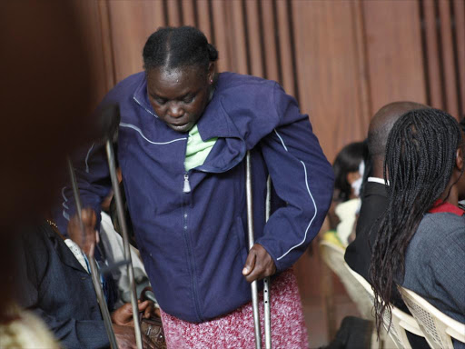 A disabled woman prepares to take a seat during a forum for the disabled people in Nairobi.\FILE