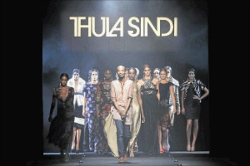 HOUSEHOLD NAME: Designer Thula Sindi showing his namesake label. Photo: Simon Deiner