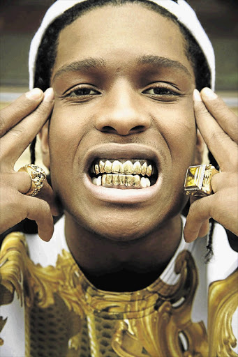 Rapper A$AP Rocky shows off his golden grill.