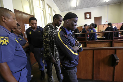 BODY SNATCHERS Alleged cannibals Nino Mbatha and Sithembiso Sithole leave the dock after abandoning bail Picture: Jackie Clausen