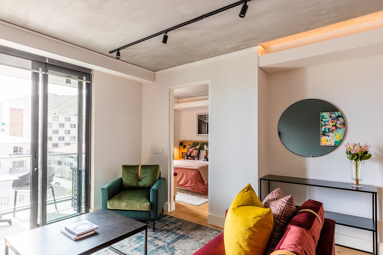 All of the apartments at Latitude, including this chic one-bedroom suite, are furnished with art and furniture sourced from local craftsmen and artists.