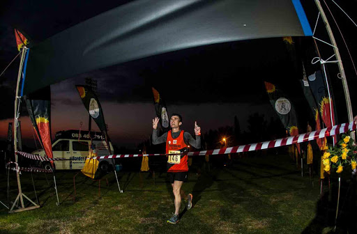 IN HIS STRIDE: Johan van der Merwe crosses the Washie finish line on Saturday morning in East London Picture: BRUCE VIAENE