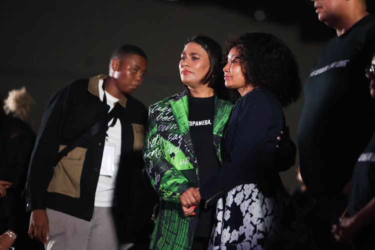 From left: :AKA’s mother Lynn Forbes shares a sombre moment with minister of tourism Lindiwe Sisulu at the Sandton Convention Centre during the memorial service for rapper Kiernan 'AKA' Jarryd Forbes.