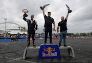 Jim McFarlane was crowned the winner of the  Red Bull Car Drift championship at Suncoast Arena in Durban on Saturday. He is flanked by Christopher Long and Juan Stemmet.