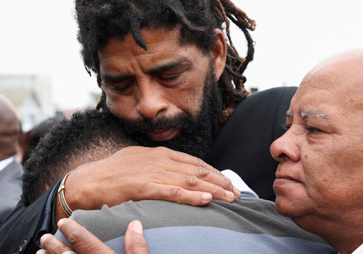 Theodore Fleurs, father of Luke Fleurs, the Kaizer Chiefs defender who was shot when his car was hijacked in Johannesburg, grieves with family and friends at the football player's funeral in Mitchell’s Plain, Cape Town, on April 20, 2024.