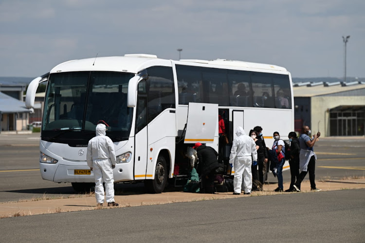 South Africans boarding buses that took them to The Ranch Resort, about 25km outside Polokwane. File photo.