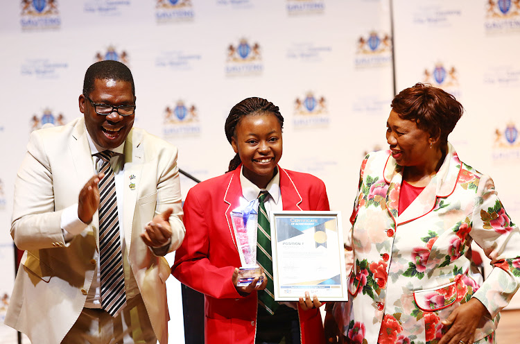 MEC for Education, Panyaza Lesufi and Minister for Basic Education, Angie Motshekga celebrate with Christine Mudzingwa from Greenside High School who is placed number one overall in the matric class of 2018 in Gauteng.