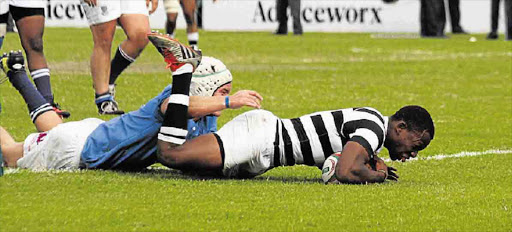 OVER THE LINE: Selbornian Phumzile Maqondwana crashes over the try line during Selborne’s 22-18 win over Grey High School in PE last year. Selborne and Grey resume hostilities when they meet at Selborne today.