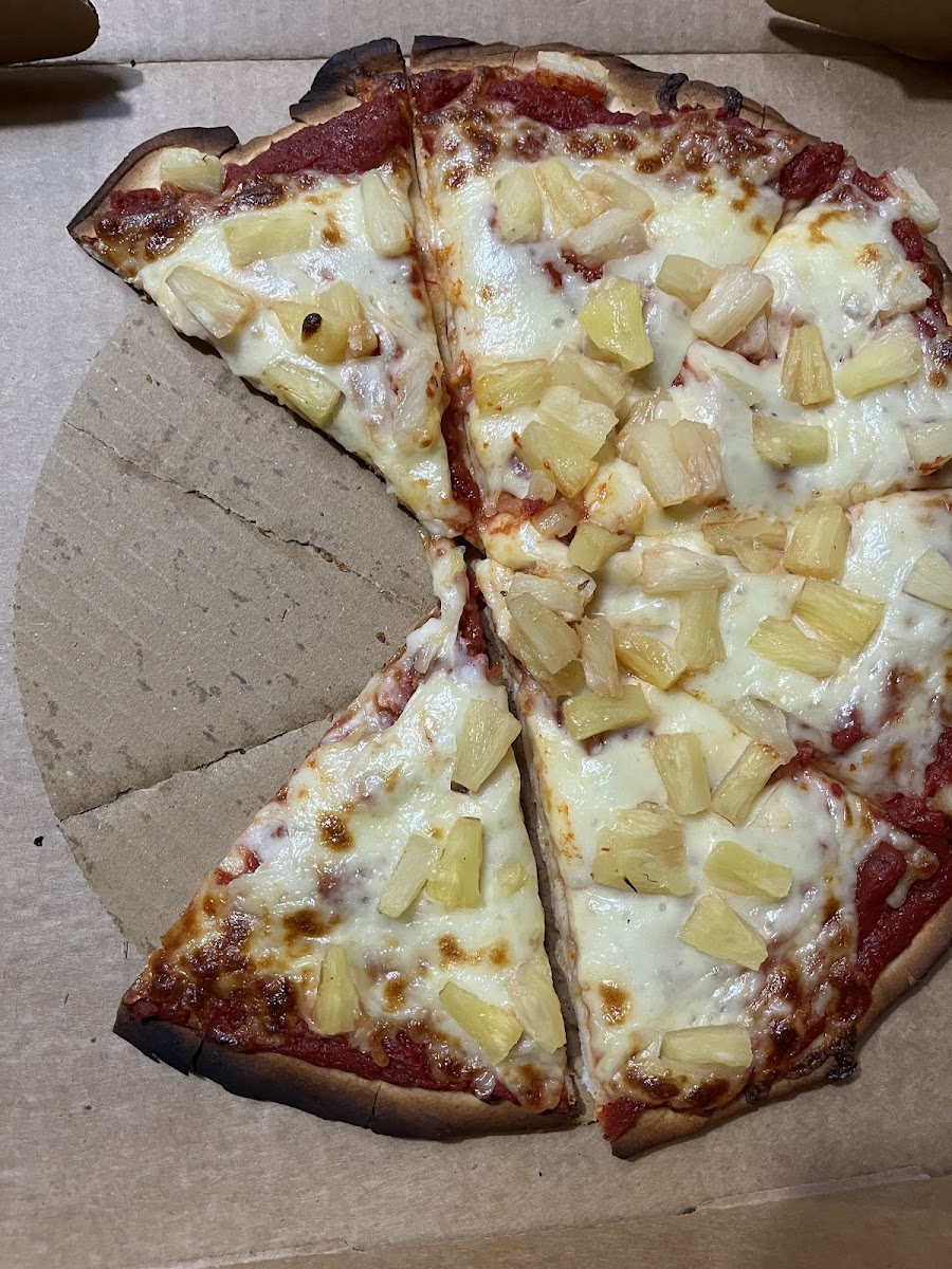 Cardboard disc under gluten free pizza