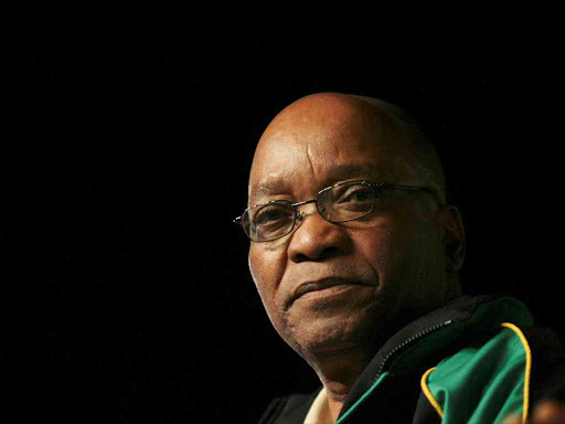 Then-South African President Jacob Zuma looks on before delivering an address in Polokwane, December 20, 2007. /REUTERS