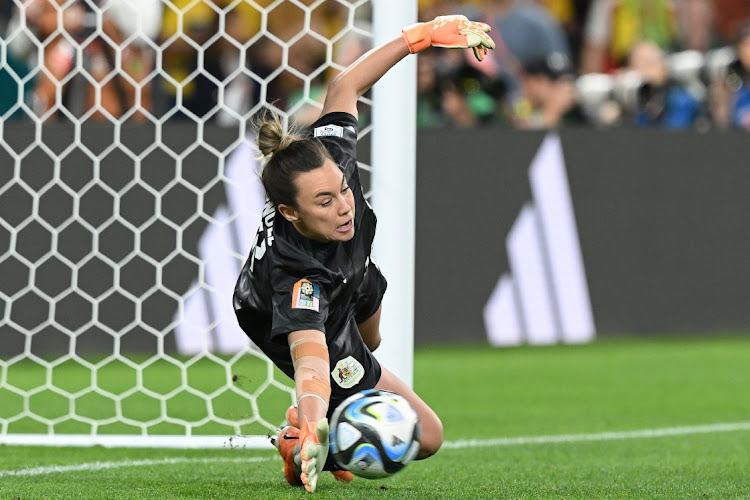 Mackenzie Arnold of Australia saves France's fifth penalty by Eve Perisset in the shoot-out during their Women's World Cup quarterfinal at Brisbane Stadium on August 12 2023.