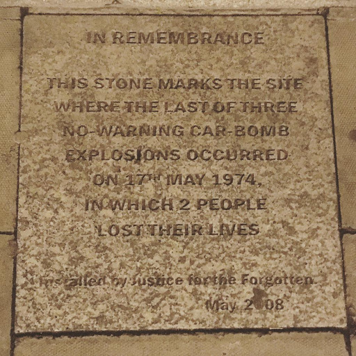 IN REMEMBRANCE THIS STONE MARKS THE SITE WHERE THE LAST OF THREE NO-WARNING CAR-BOMB EXPLOSIONS OCCURRED ON 17TH MAY 1974 IN WHICH 2 PEOPLE LOST THEIR LIVES  Installed by Justice for the...