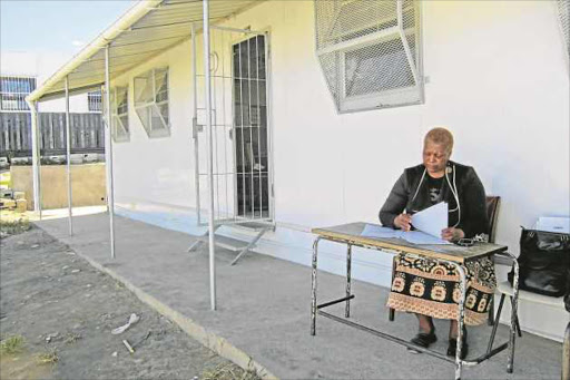 BACKBENCHER: Nokuzola Ndabambi sits outside a classroom at Sinempumelelo Primary School, in Nompumelelo Picture: SIYA BOYA