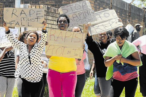 Angry: Residents protest at court in Dimbaza where a rape suspect appeared yesterday