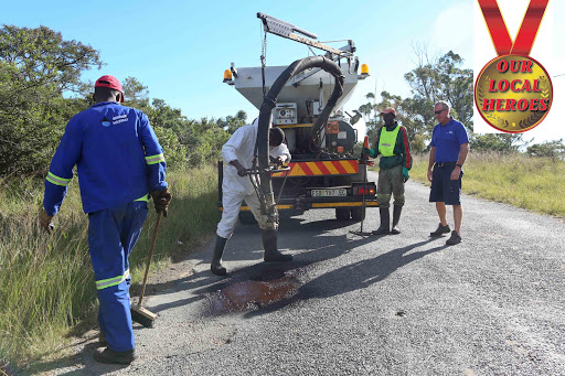 POTHOLE HEROES: Martin Harmse and his team can fill potholes in a matter of minutes with the jet patcher machine Picture: STEPHANIE LLOYD