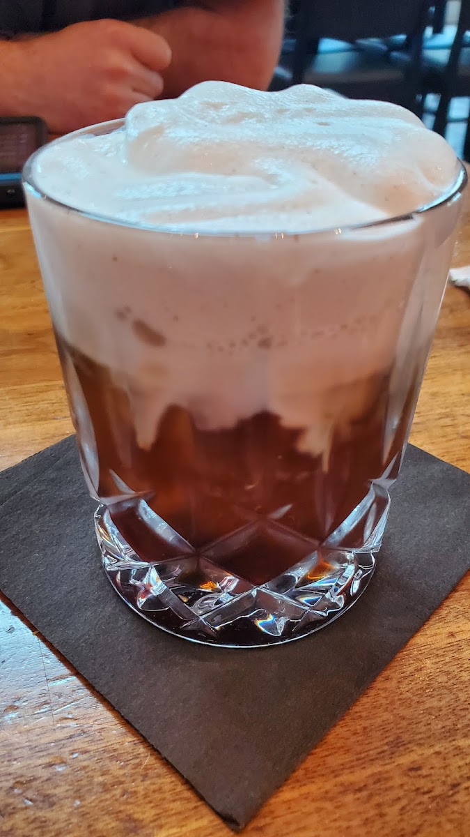 Cold brew coffee cocktail with vanilla bean foam