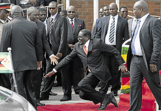 Robert Mugabe taking a fall. File photo.