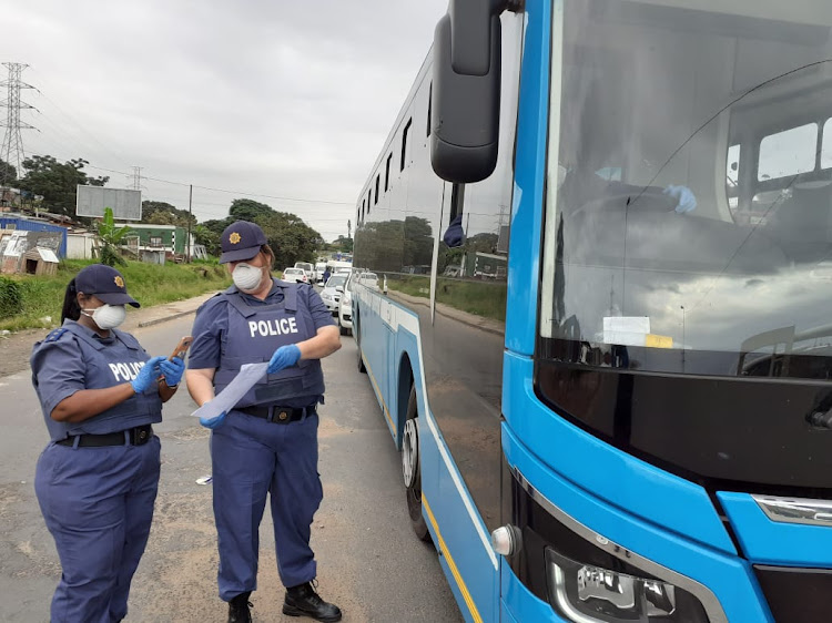 Police in Umlazi, south of Durban, inspect permits to allow essential services workers to be out on the roads during the lockdown.