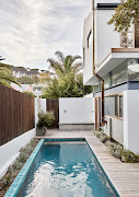 The pool’s ceramic tiles were commissioned to match the colour of the crockery set made by the homeowner's mom.