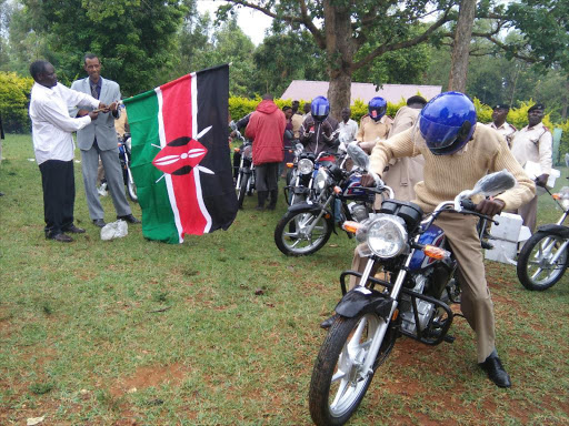 Kasipul MP Oyugi Magwanga and Rachuonyo South deputy county commissioner Mohamed Ibrahim flag off motorcyles donated to chiefs in Oyugis town on Thursday