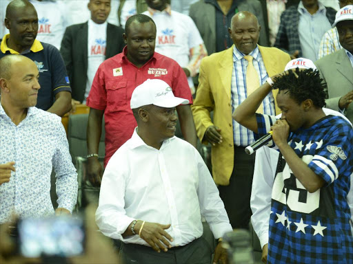 Governor aspirants Peter Kenneth (Nairobi) and William Kabogo (Kiambu) with Gospel artist Bahati during the launch of the Kenya Alliance of Independent Candidates in Kasarani Gymnasium on Saturday /NG’ANG’A THAIRU