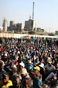 Thousands of Association of Mineworkers and Construction Union (Amcu) members gathered at Wonderkop Stadium near Rustenburg this week, calling for the rival National Union of Mineworkers to vacate offices at Lonmin’s Marikana mine, where Amcu claims to be the majority union. The rand fell to a new four-year low against the dollar on Thursday on fears of a strike at another mining company, Amplats. Pic: SIMPHIWE NKWALI.