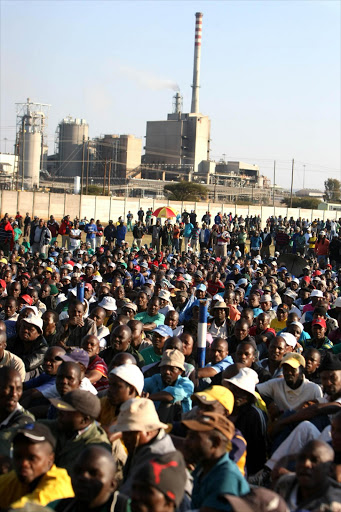Thousands of Association of Mineworkers and Construction Union (Amcu) members gathered at Wonderkop Stadium near Rustenburg this week, calling for the rival National Union of Mineworkers to vacate offices at Lonmin’s Marikana mine, where Amcu claims to be the majority union. The rand fell to a new four-year low against the dollar on Thursday on fears of a strike at another mining company, Amplats. Pic: SIMPHIWE NKWALI.