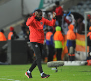 Orlando Pirates' assistant coach Rulani Mokwena celebrates an goal during the Telkom Knockout Last 16 match against Chippa United on October 20, 2018 at Orlando Stadium in Soweto, south west of Johannesburg.