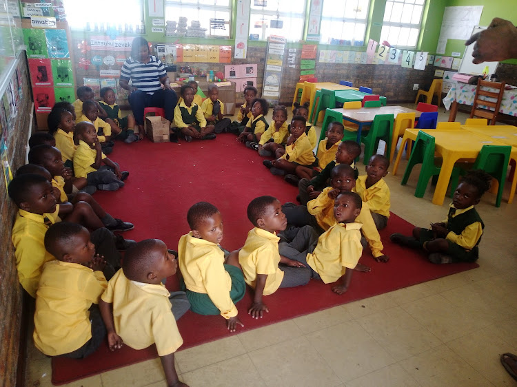 Intshinga Primary School pupils eagerly awaiting their new supply of books.